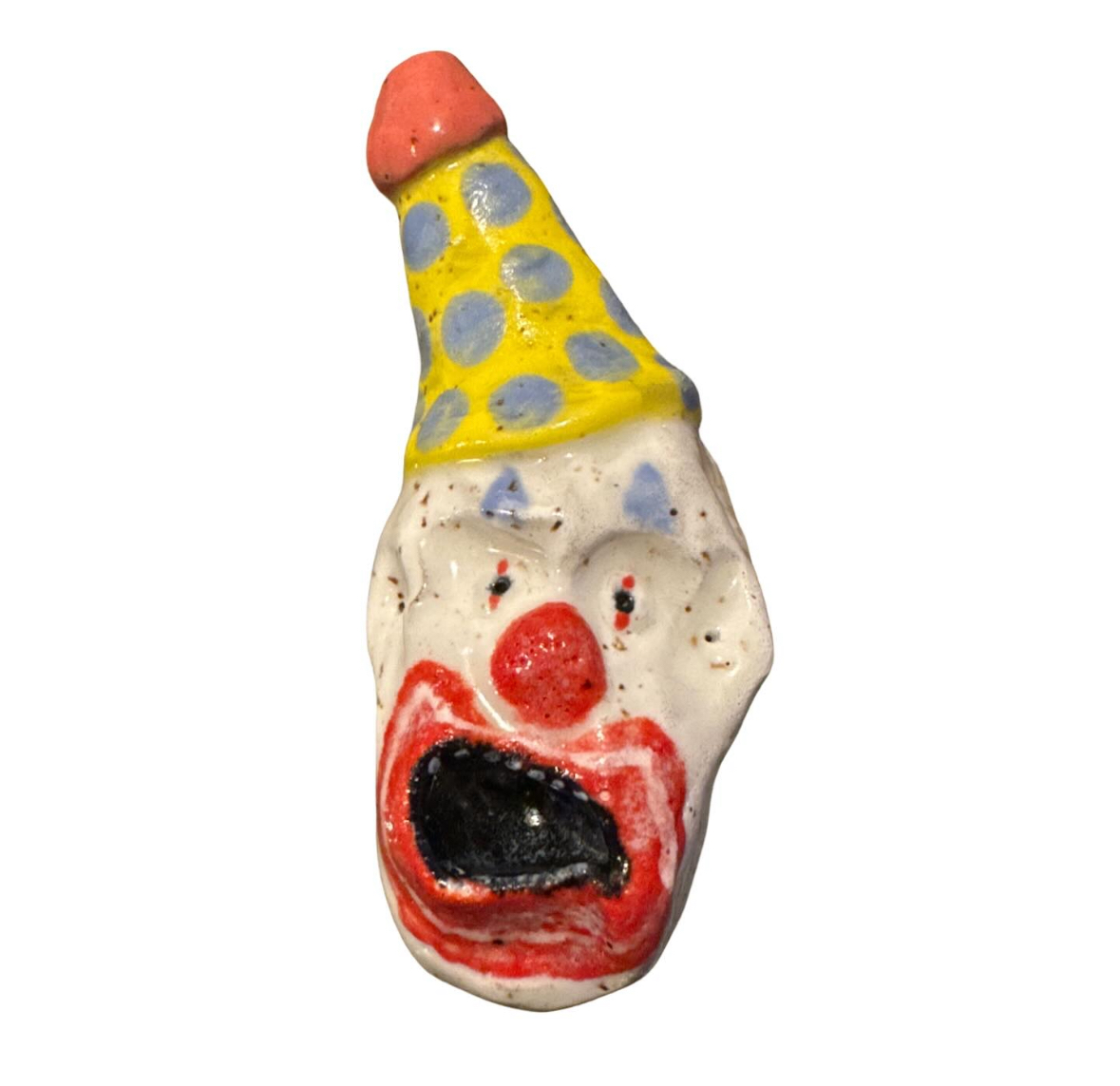 Ceramic clown head with yellow polka-dot party hat
