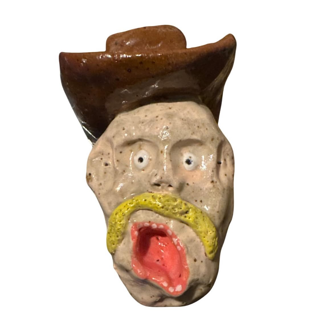 Ceramic cowboy head with brown hat and yellow mustache