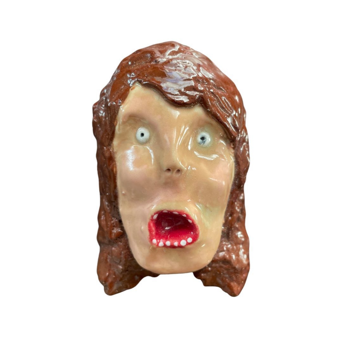 Ceramic woman head with long brown hair and open mouth