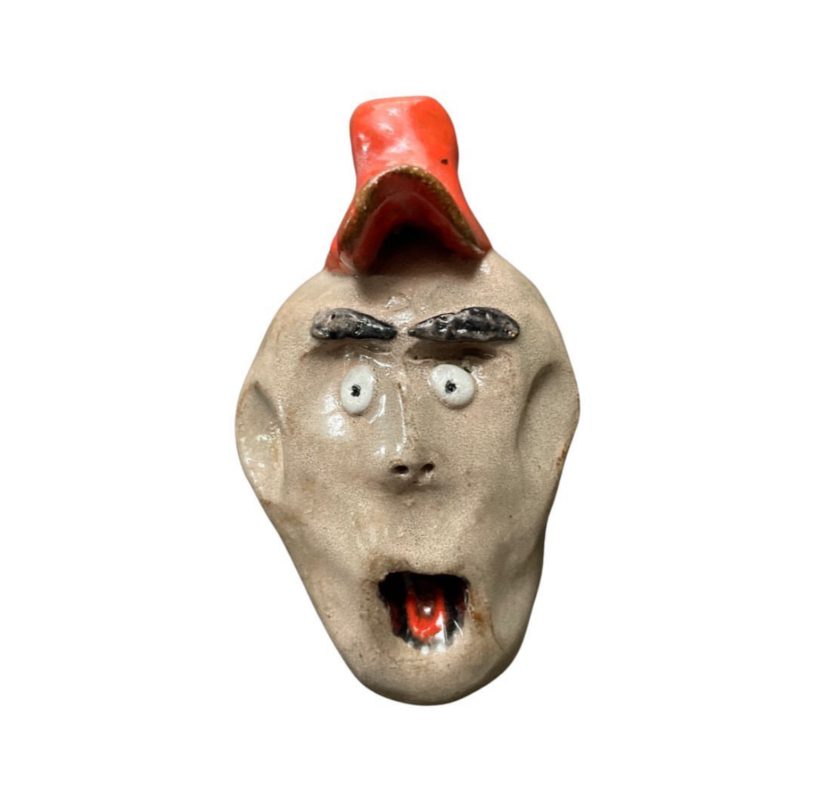 Ceramic head with red mohawk and angry expression