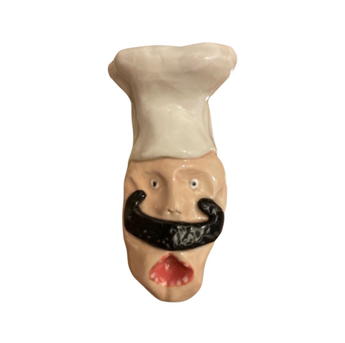 Ceramic chef head with white toque and black handlebar mustache
