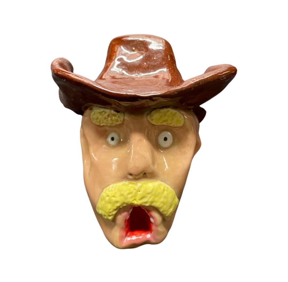 Ceramic cowboy head with brown hat and yellow mustache