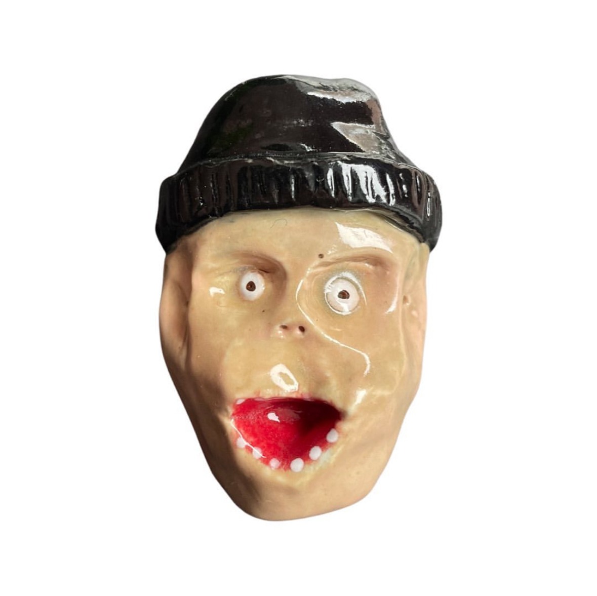 Ceramic head with black beanie and shocked expression