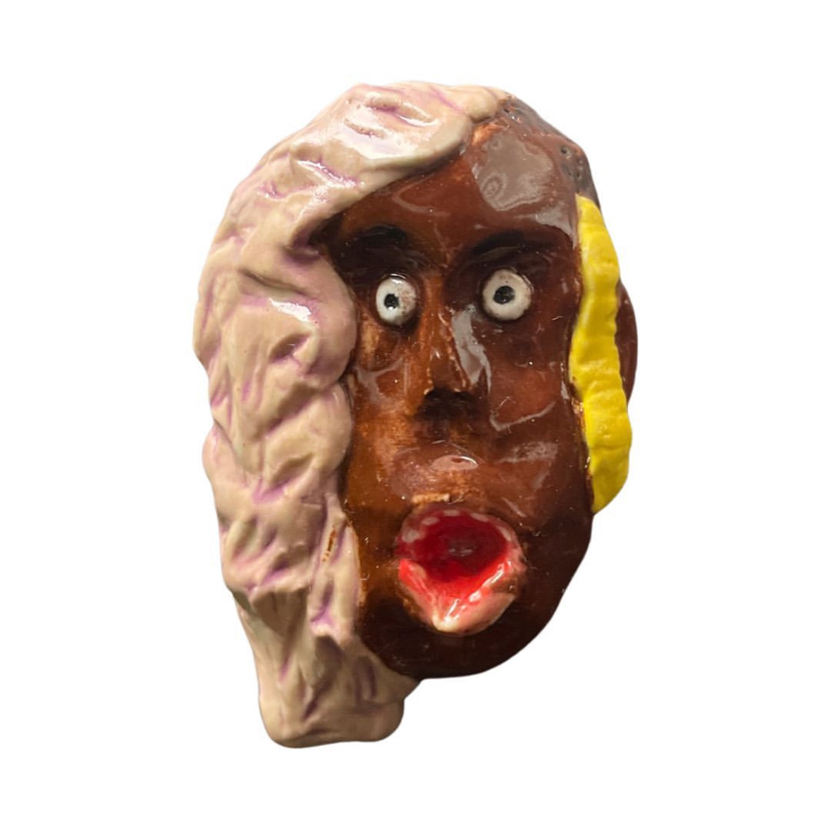 Ceramic head with pink hood and yellow ear