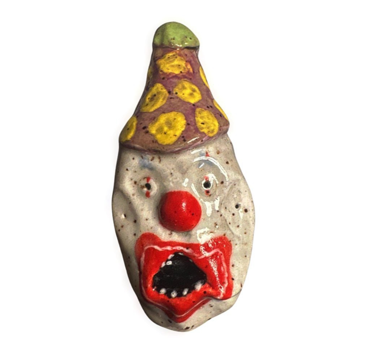 Ceramic clown head with purple and yellow polka-dot party hat