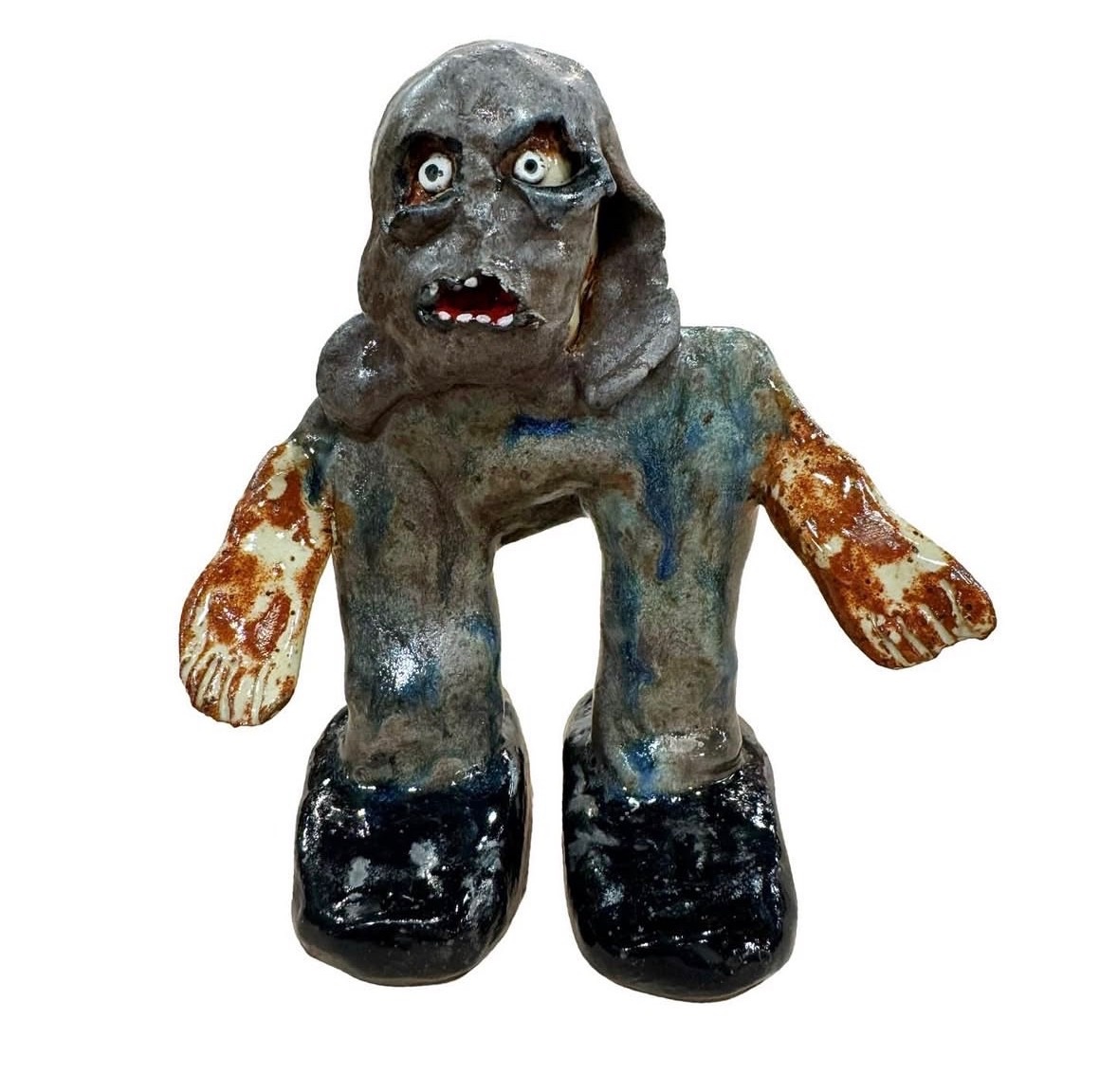Ceramic gray hooded ghoul figure with rust hands and black boots