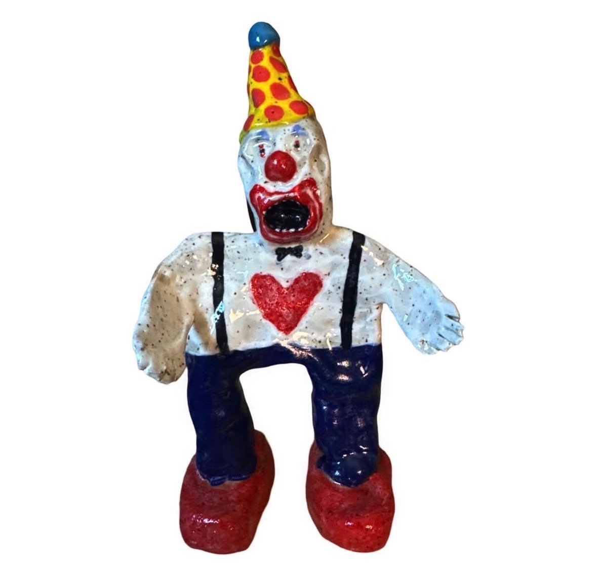 Ceramic clown figure with bowtie, heart shirt and red shoes