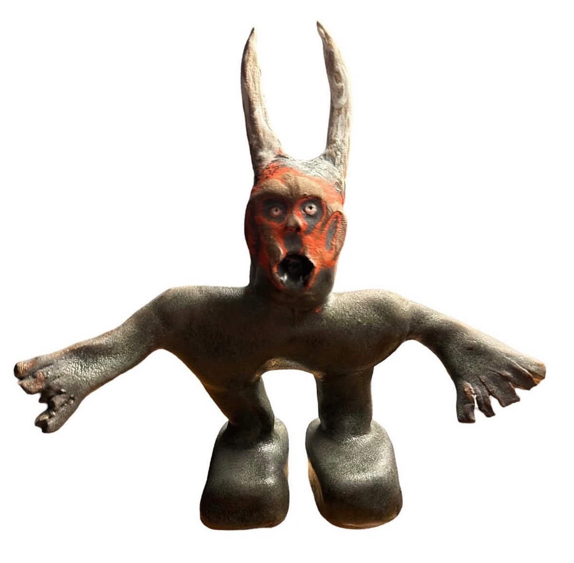 Ceramic gray horned devil figure with red face and screaming mouth