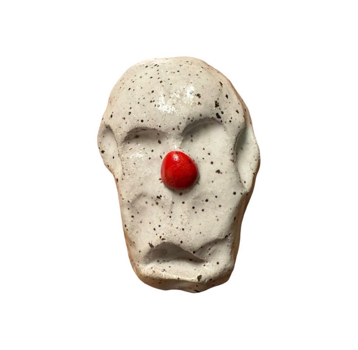 Ceramic speckled clown head with red nose and no eyes or mouth