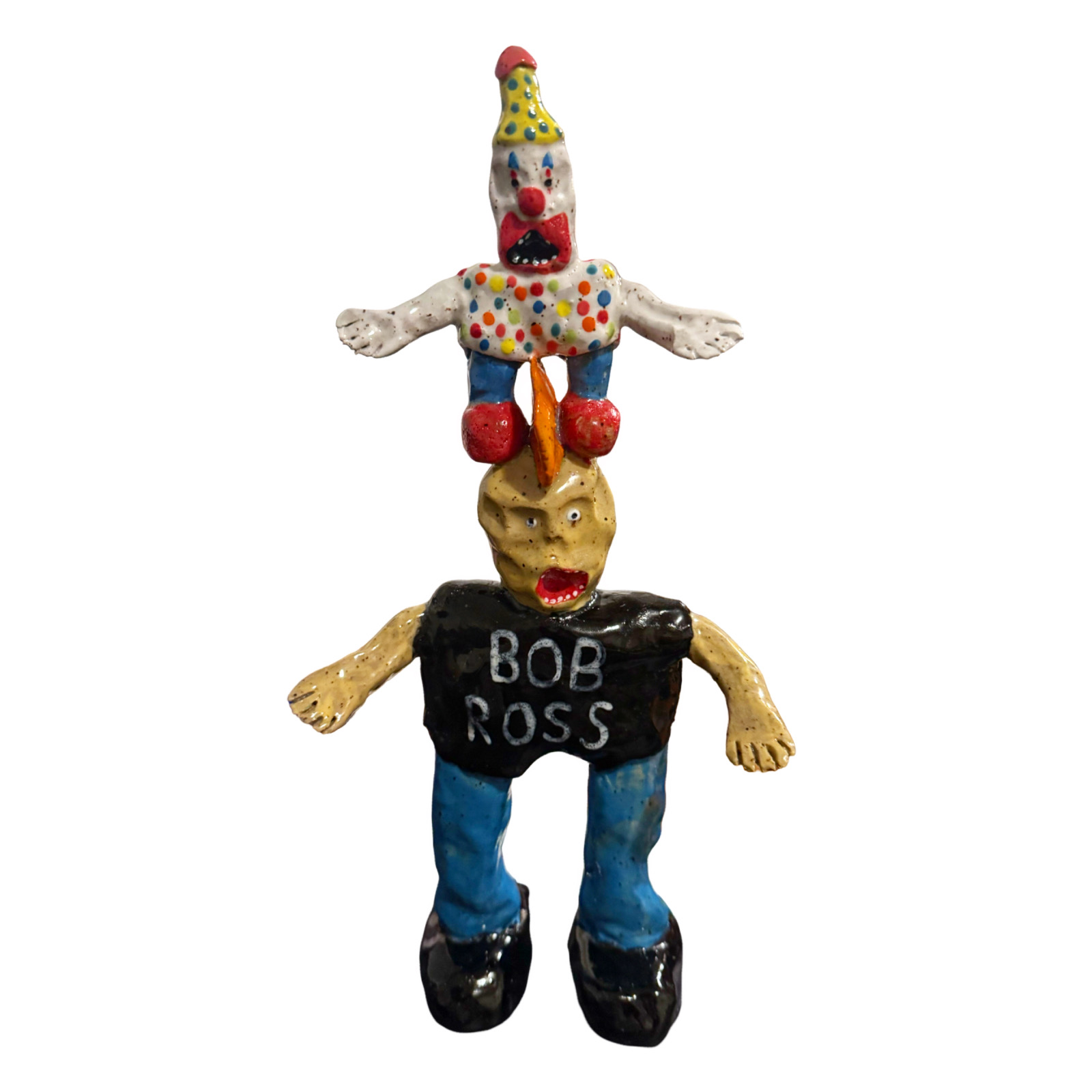 Ceramic Bob Ross figure with clown balanced on head