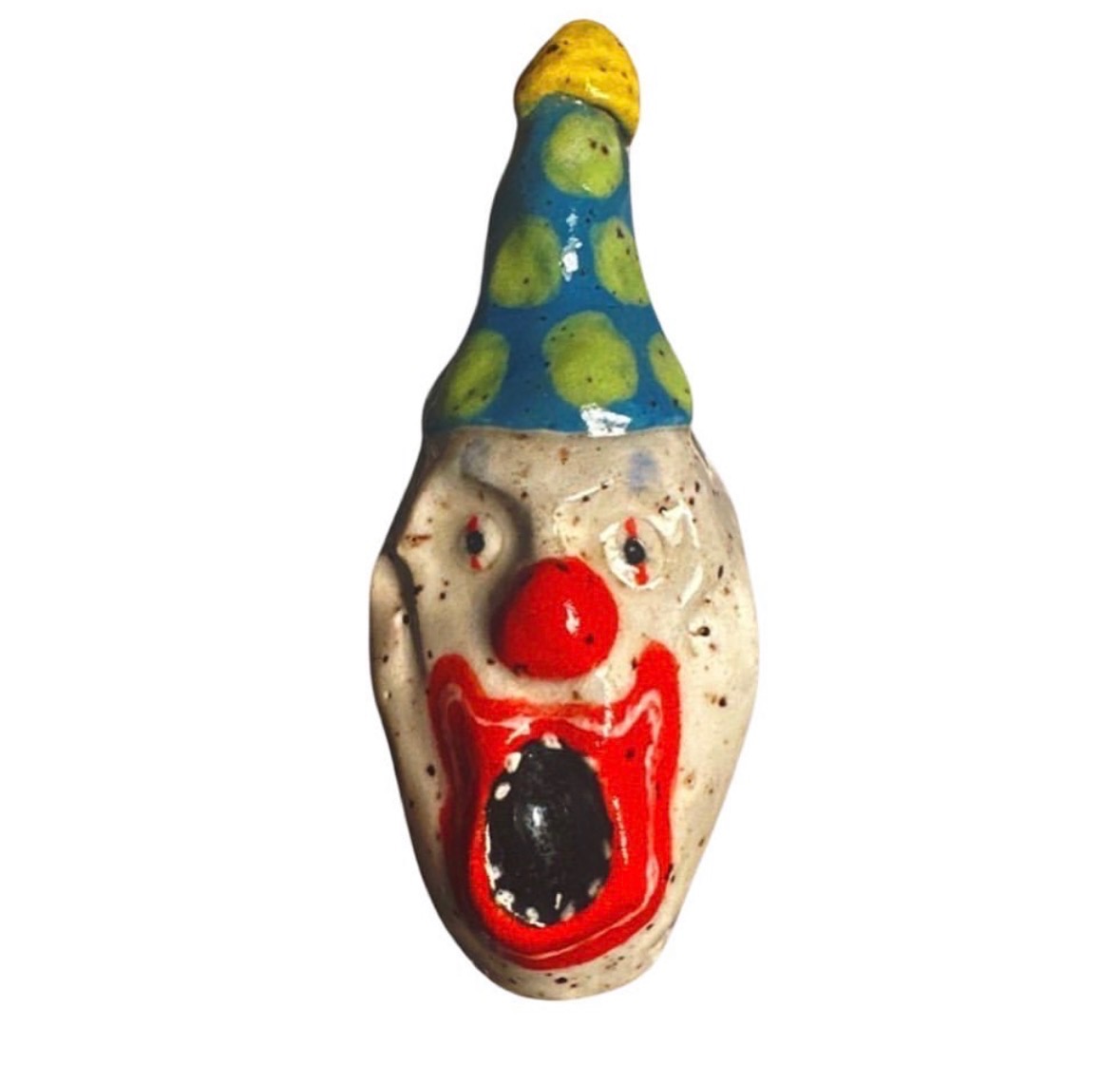 Ceramic screaming clown head with blue and green polka-dot party hat with yellow tip