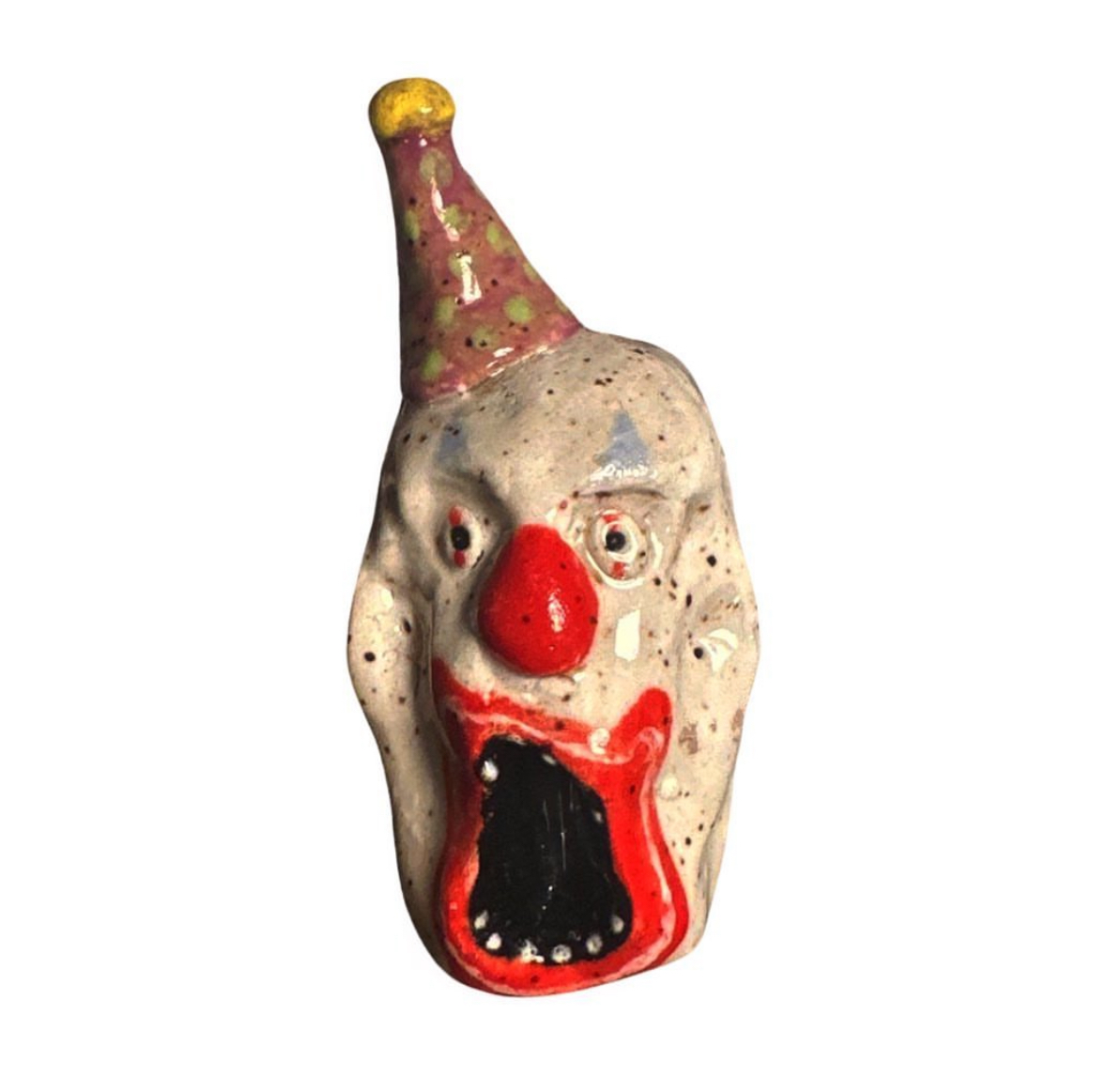 Ceramic clown head with pink polka-dot party hat