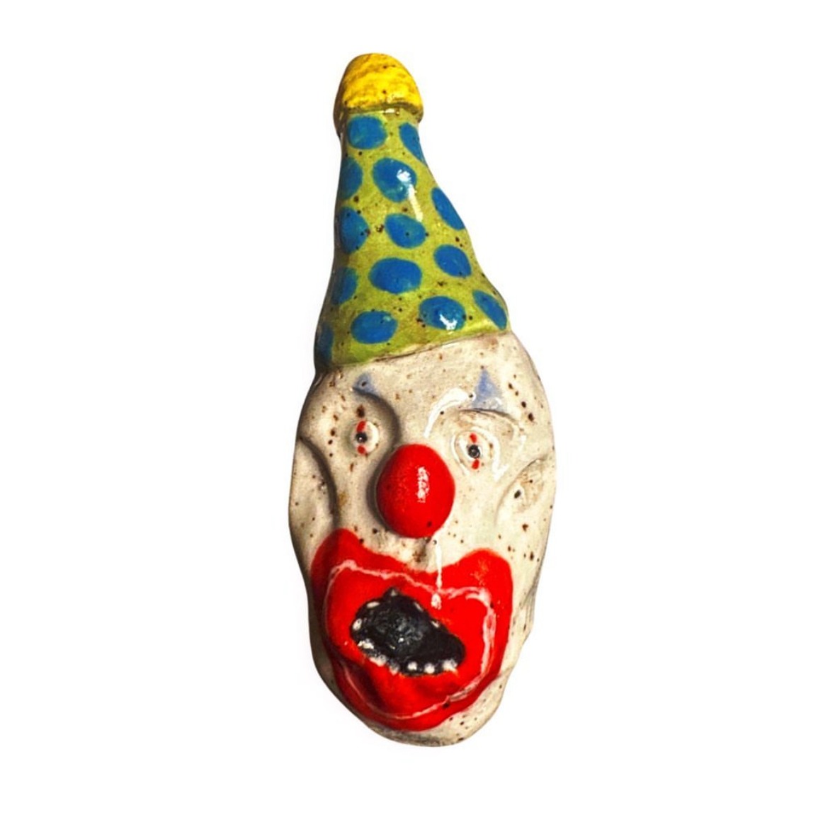 Ceramic clown head with green and blue polka-dot party hat