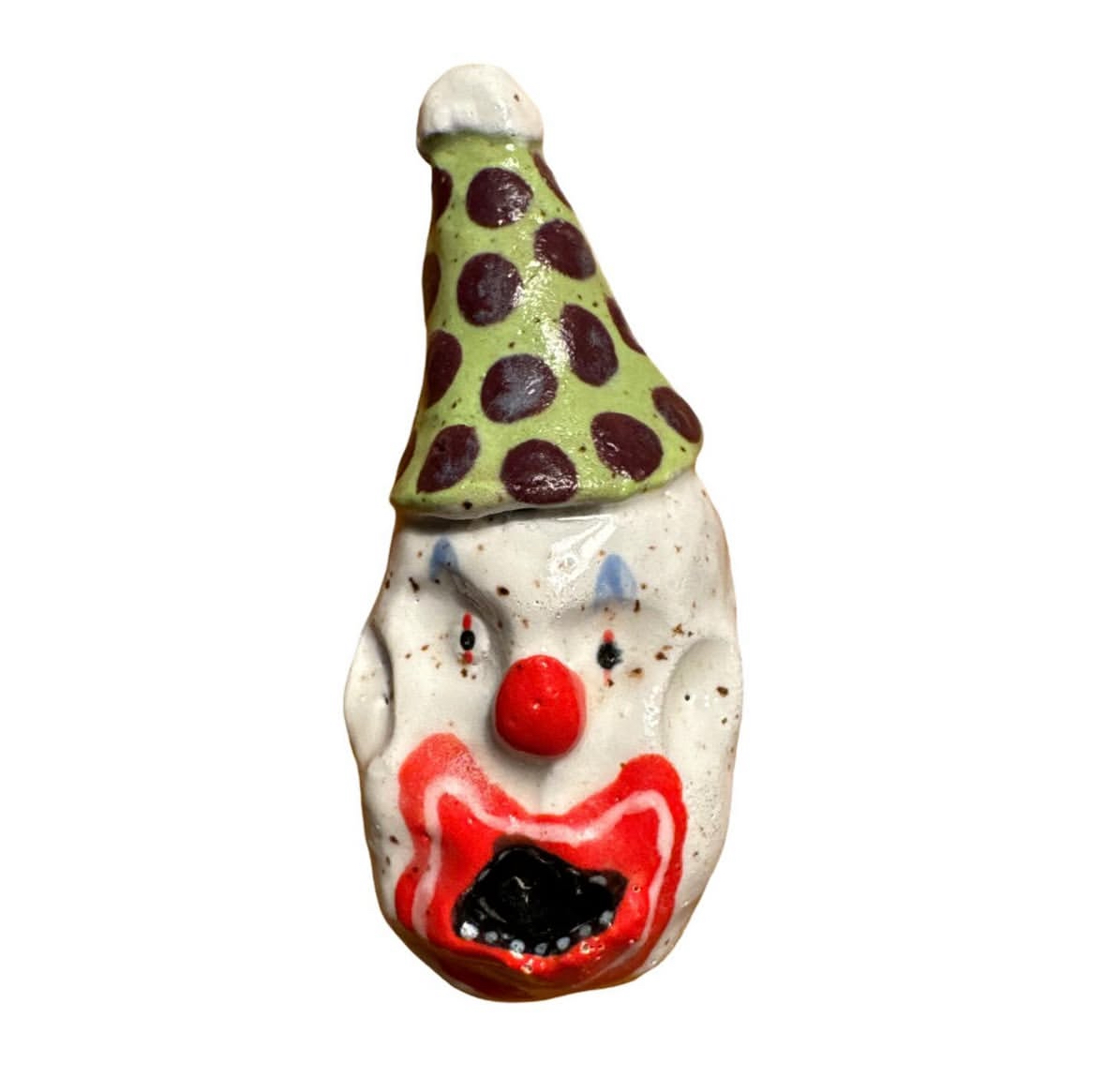 Ceramic clown head with green and maroon polka-dot party hat