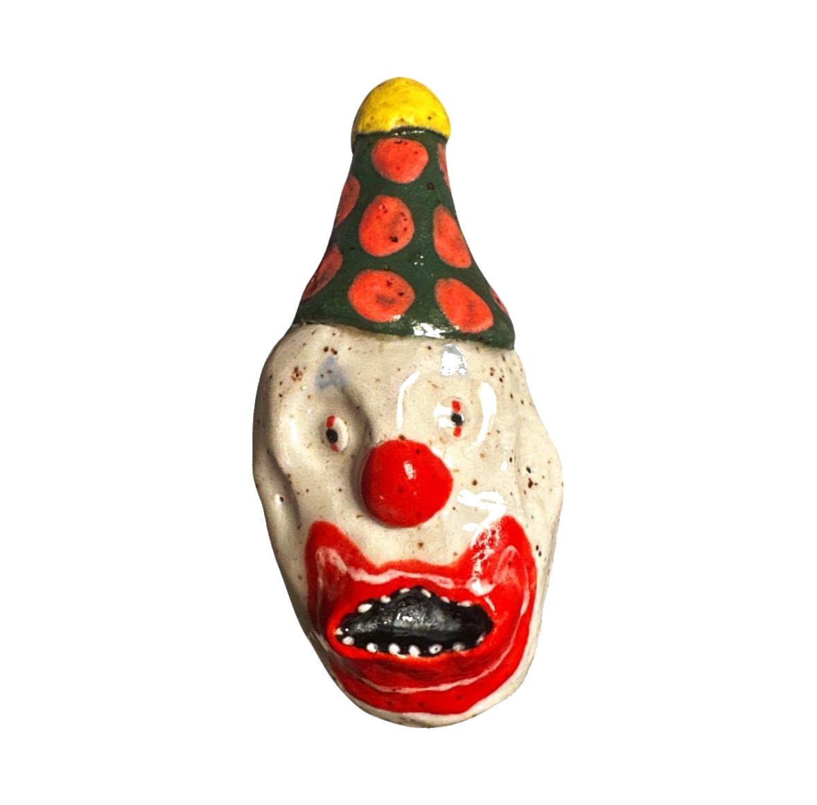 Ceramic clown head with green and red polka-dot party hat
