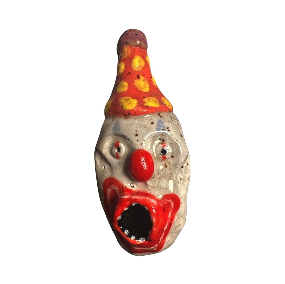 Ceramic clown head with orange and yellow polka-dot party hat