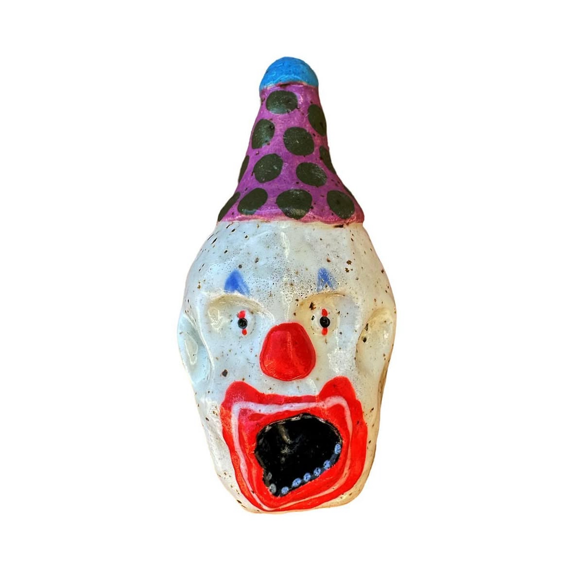 Ceramic clown head with purple and black polka-dot party hat