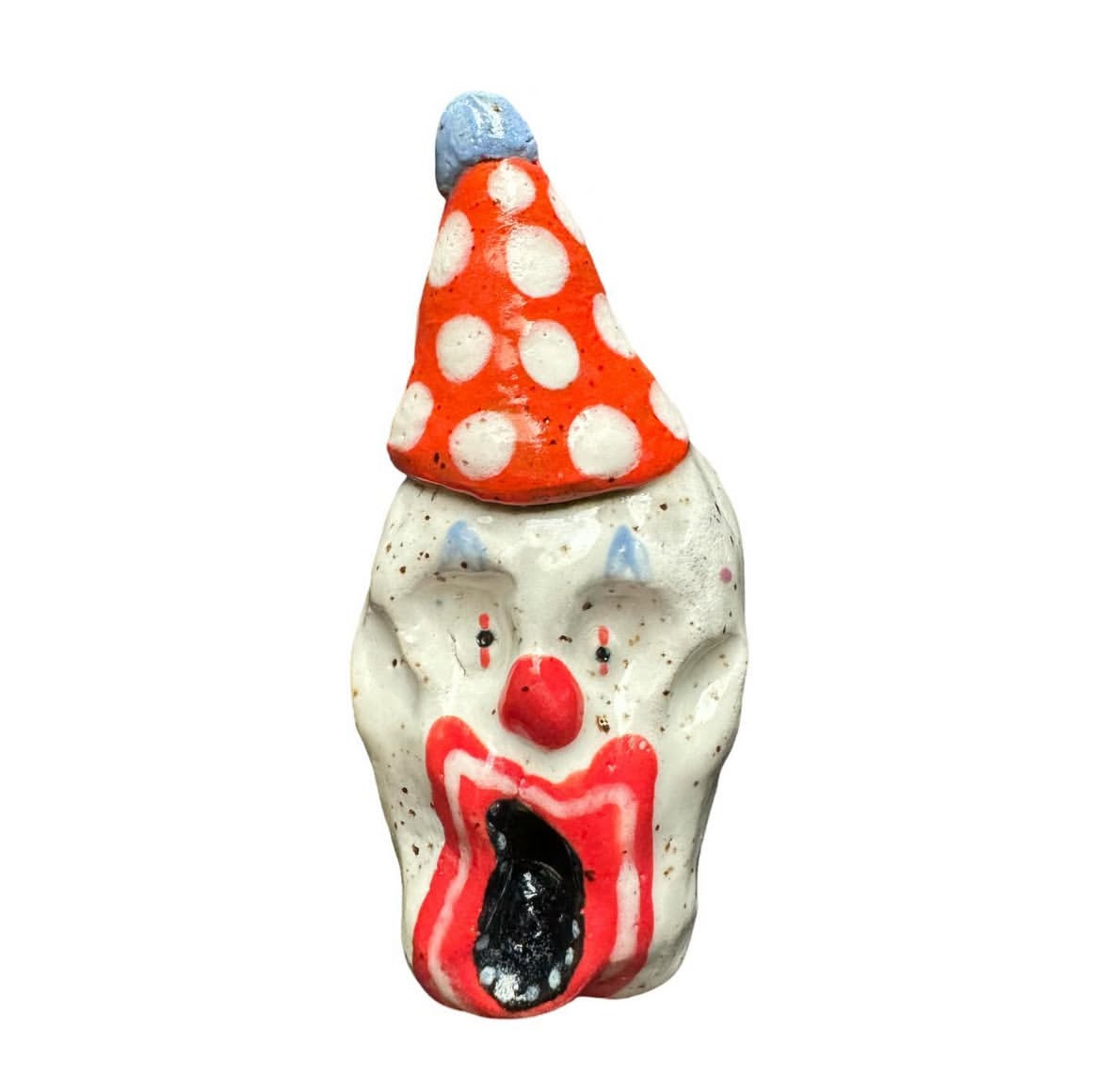 Ceramic clown head with red and white polka-dot party hat