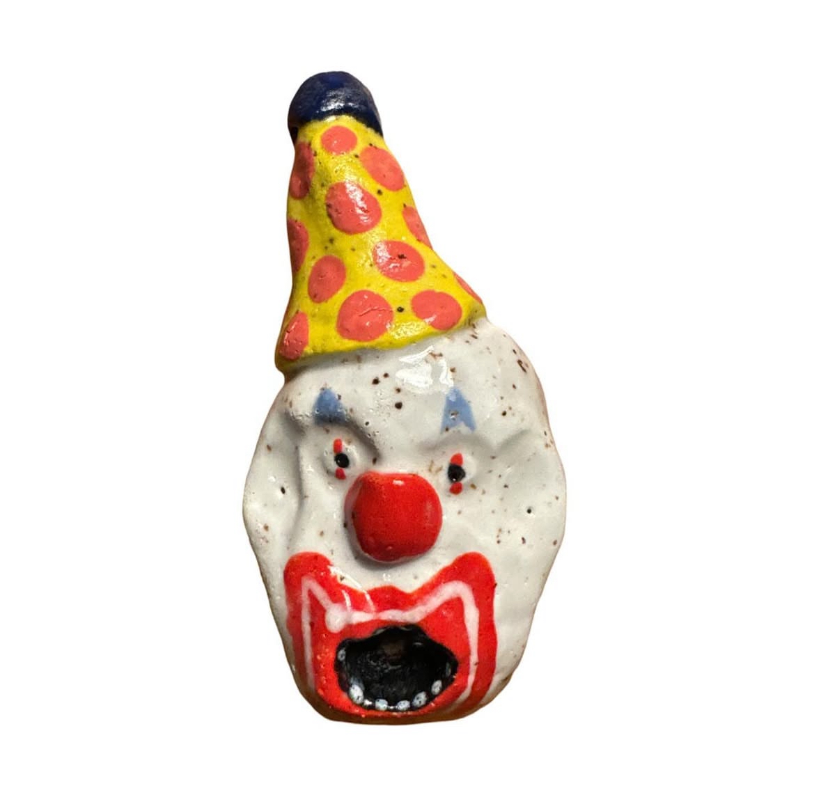 Ceramic clown head with yellow and red polka-dot party hat