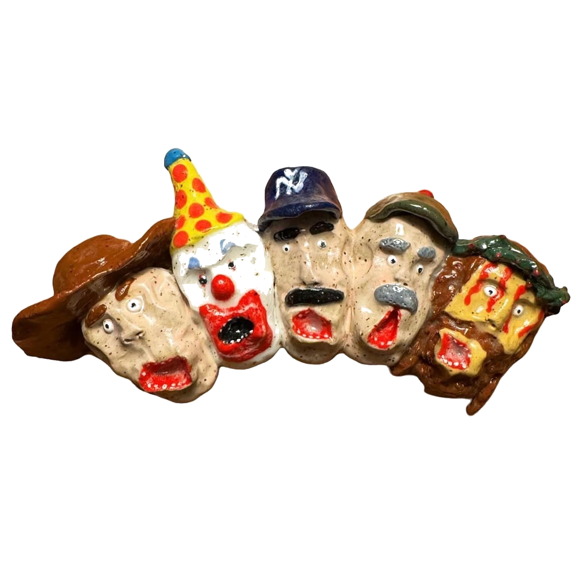 Ceramic wall sculpture with row of faces including clown, baseball cap and Jesus