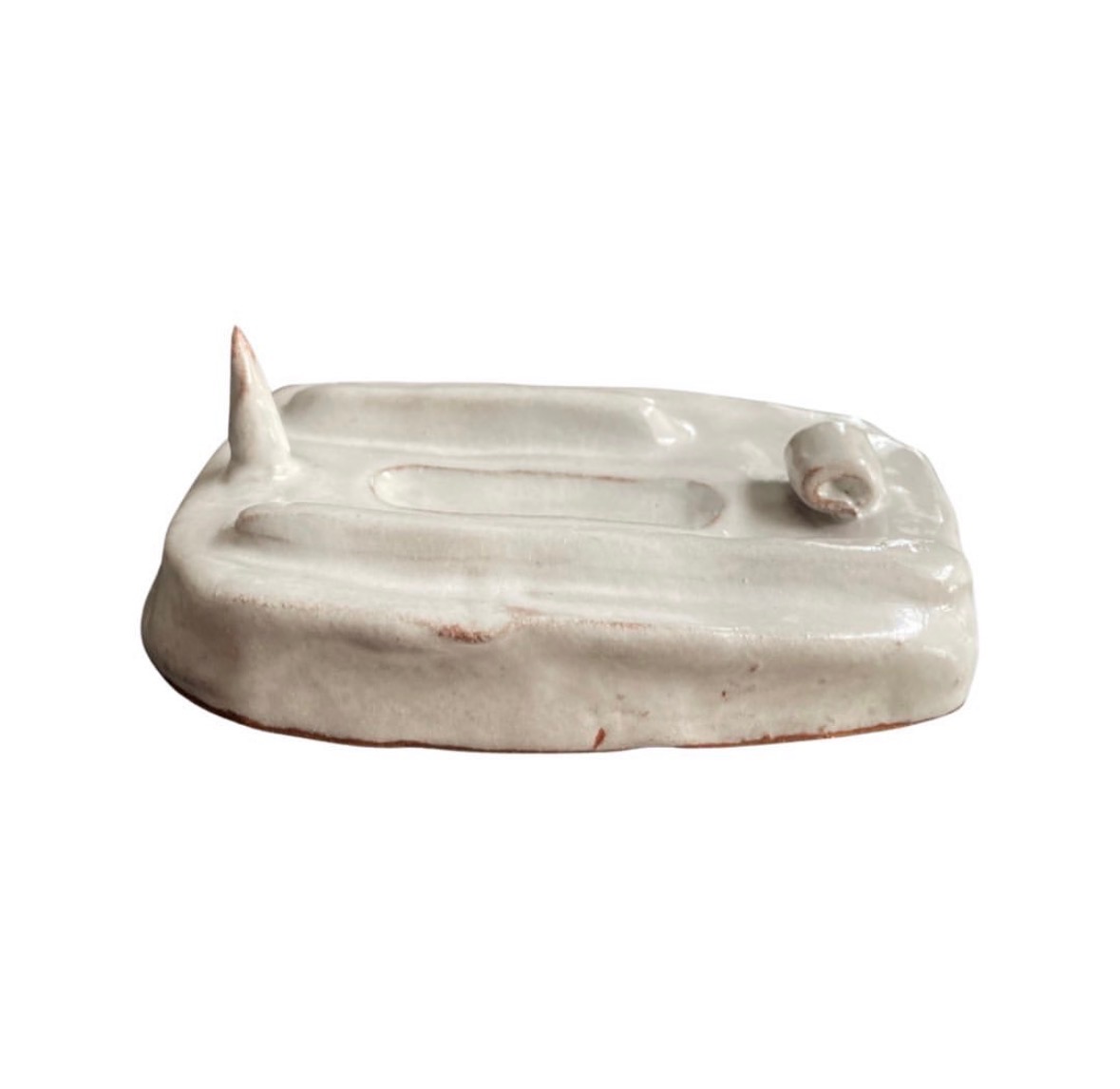 Ceramic white-glazed landscape sculpture with spire and small vessel