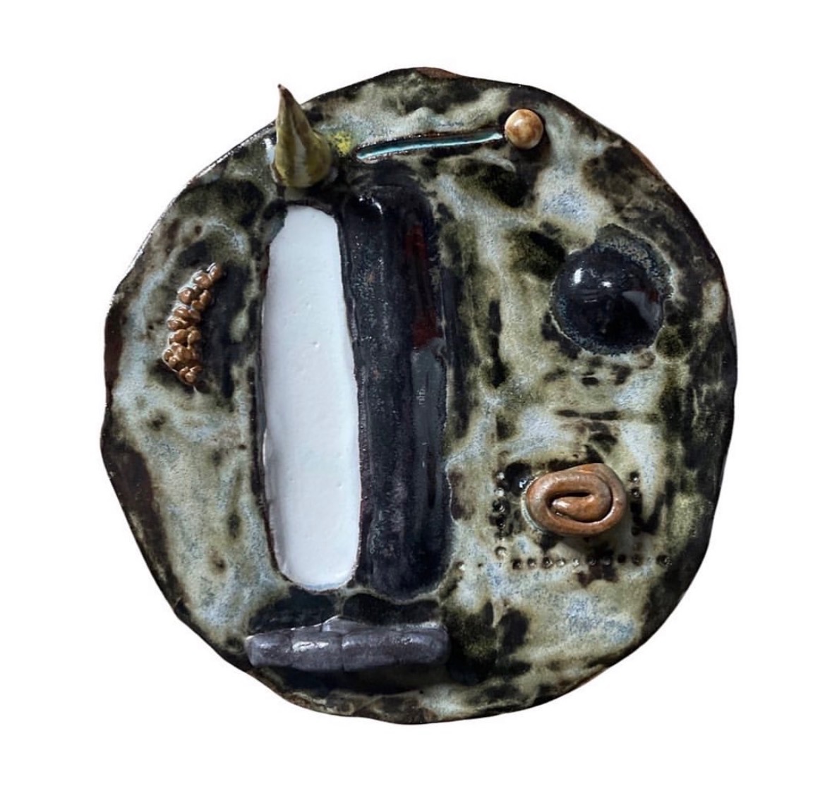 Ceramic landscape sculpture top-down view with green glaze and abstract elements