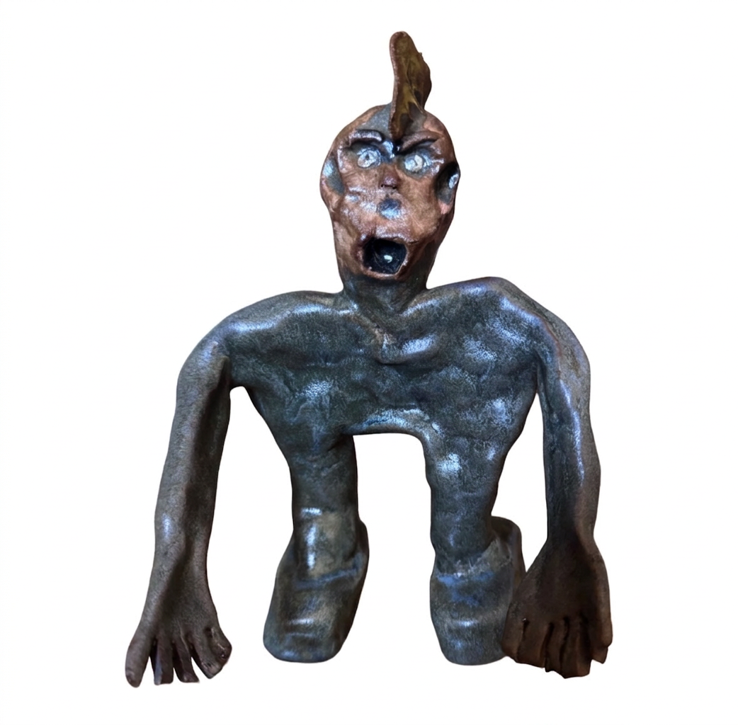 Ceramic crouching figure with mohawk
