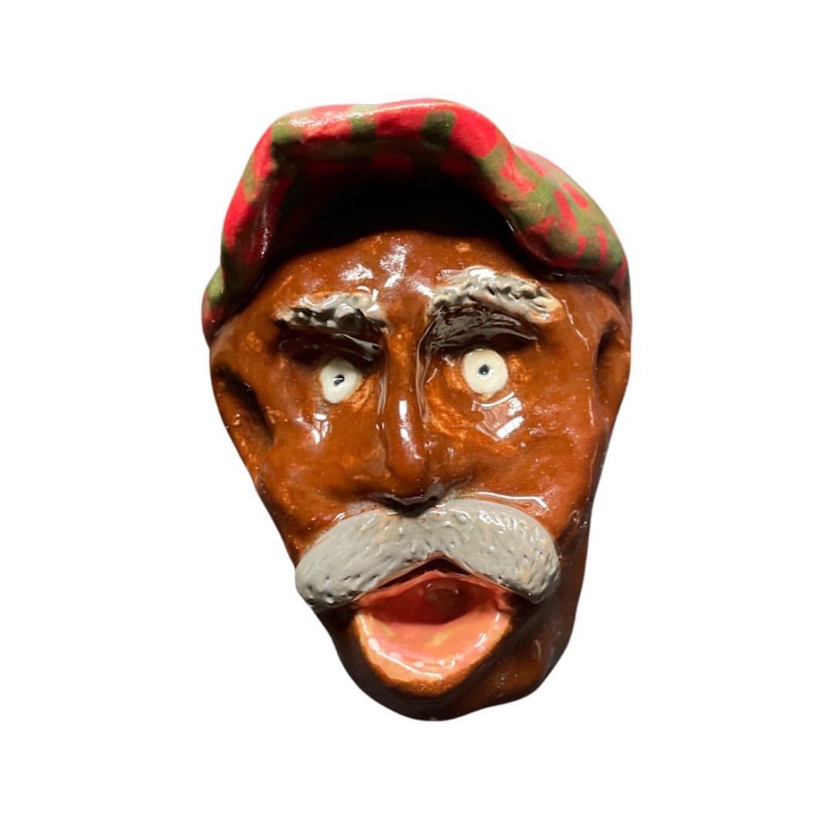 Ceramic brown head with red and green checkered cap, gray mustache and open mouth