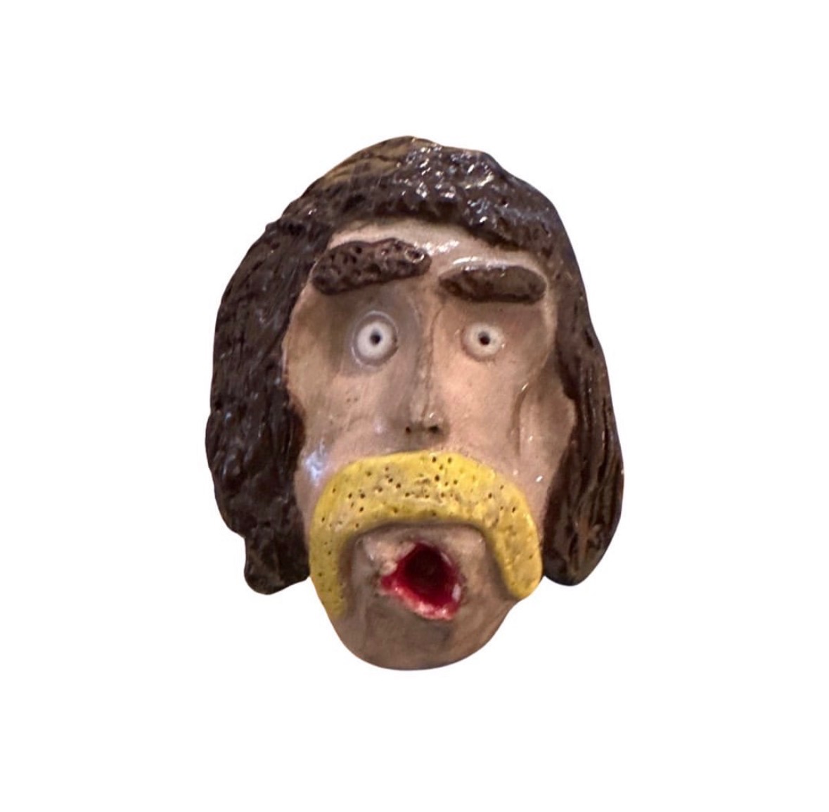 Ceramic head with long brown hair, yellow mustache and open red mouth
