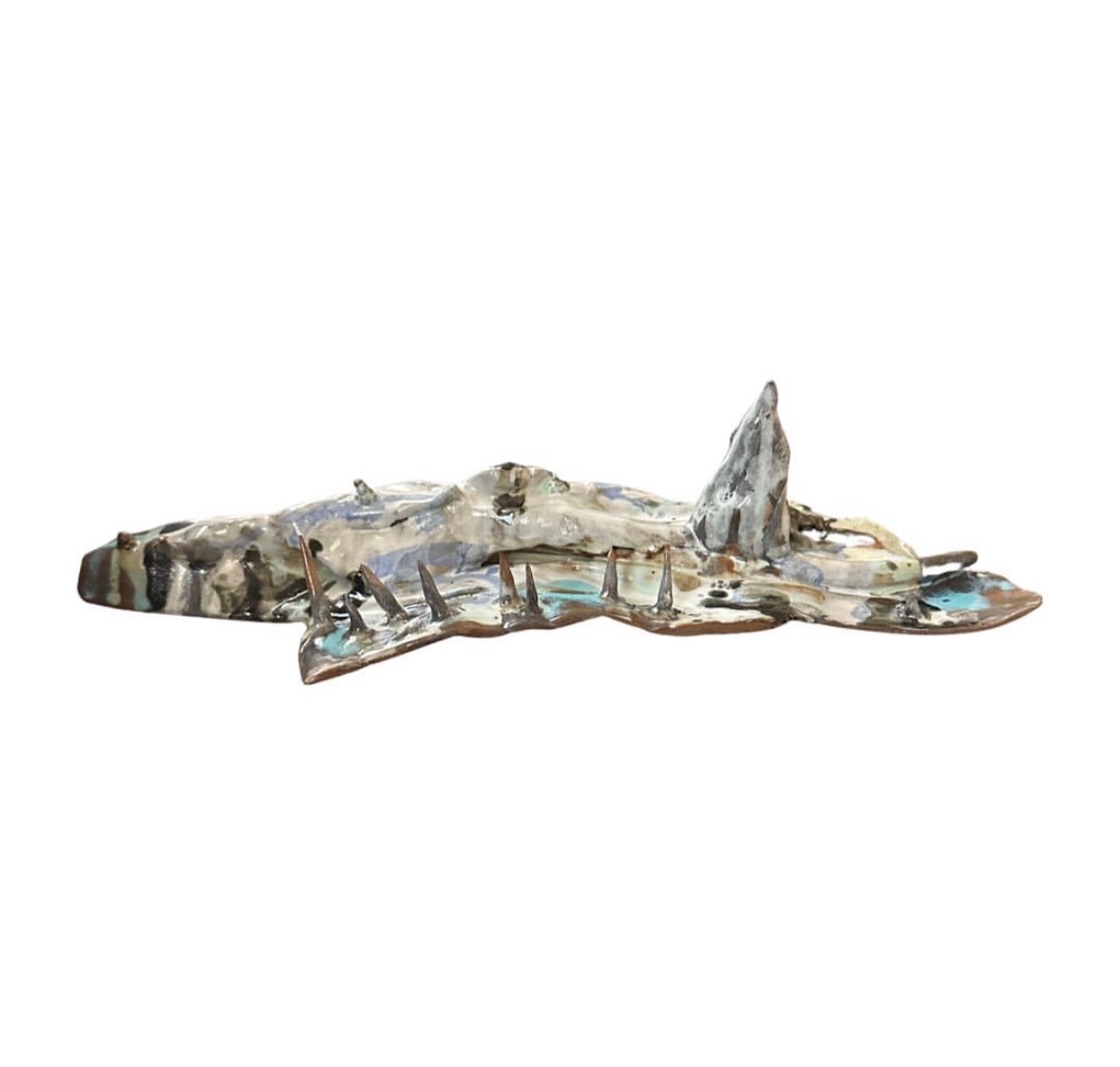 Ceramic ridge sculpture alternate side view with row of spikes and tall peak