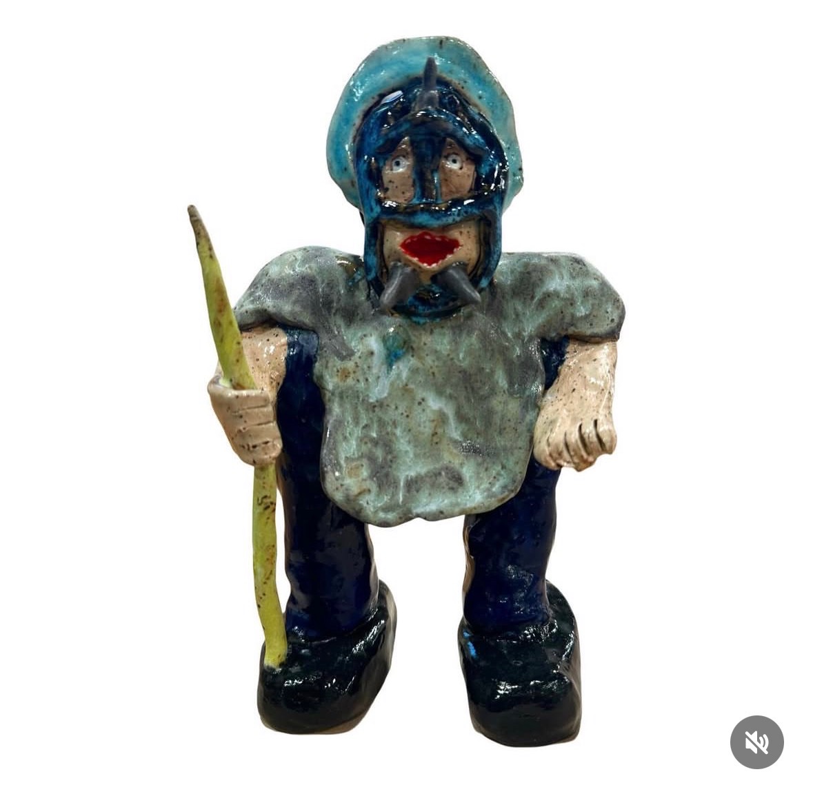 Ceramic warrior figure with blue helmet, armor and staff