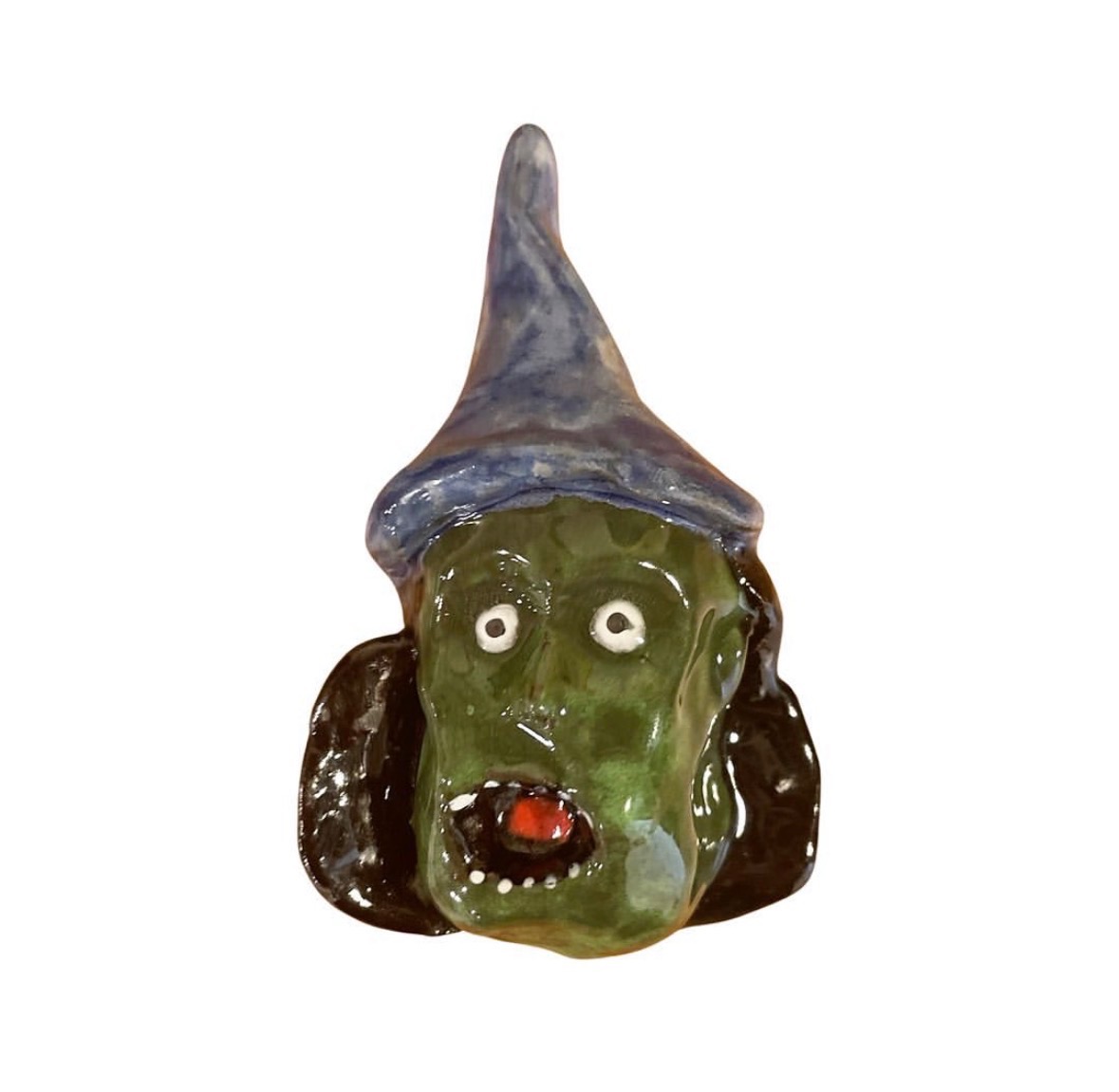 Ceramic green-faced witch head with blue pointed hat and open red mouth